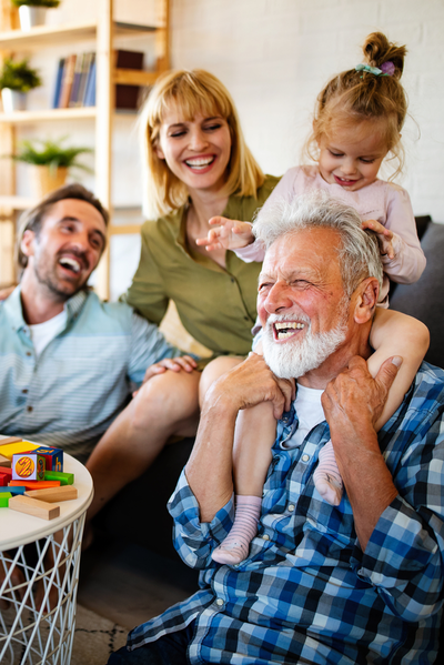 mother, father, and grandfather, with young girl