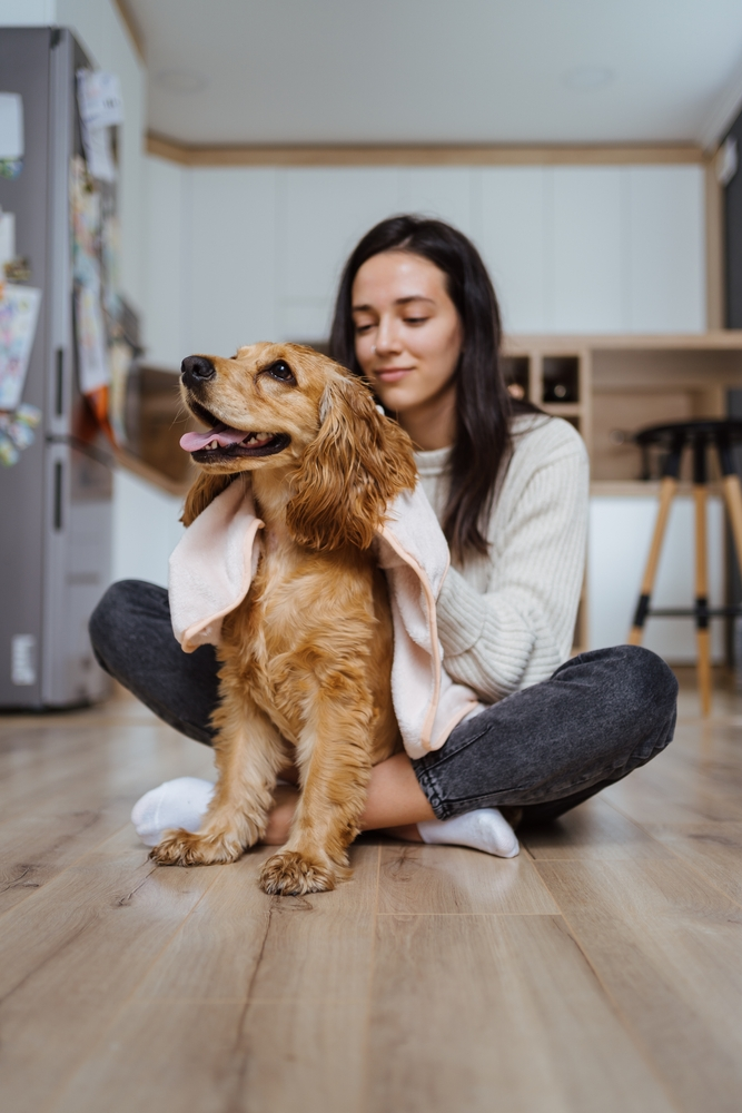 woman with dog at home