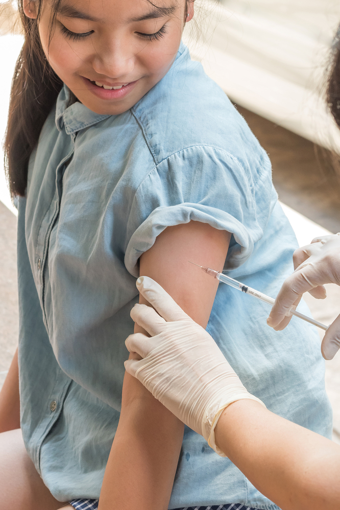 girl getting vaccine